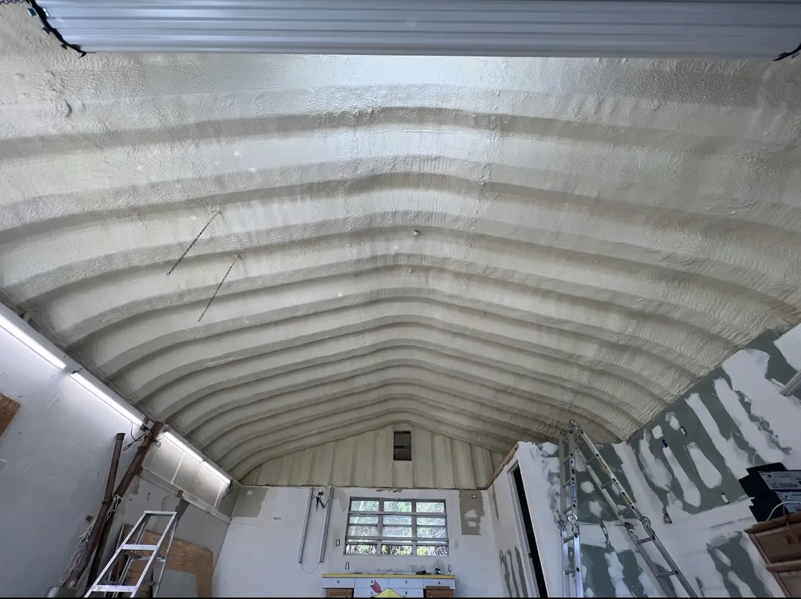 Spray polyurethane foam applied to the underside of a metal roof deck in Belchertown